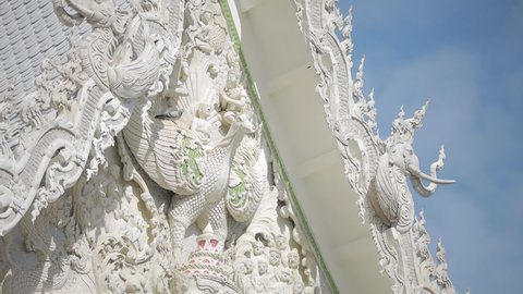 Pigeon and Beautiful White Giand Pattern Wall in Temple of Thailand,Beautiful Temple in Sunny Day