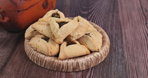 Traditional jewish hamantaschen cookies cakes with purim celebration Jewish carnival