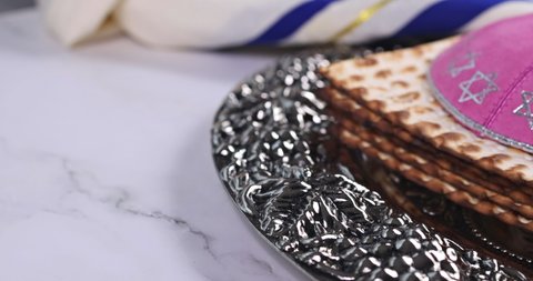 Pesach Jewish traditional celebration with Torah Scrolls, kosher matzah on passover holiday
