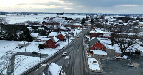 Village of Intercourse Pennsylvania. Lancaster County PA tourist attraction. Winter snow scene in evening. Aerial at dusk.