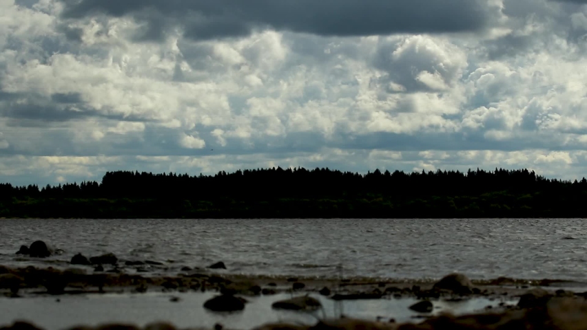 Dramatic sky with grey clouds over the city before the storm. Weather before or after a storm,time lapse