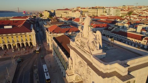 aerial view of Lisbon historic downtown district at sunrise, flying around Triumphal arch at Rua Augusta at Commerce square, Portugal tourism and travel concept. High quality 4k footage
