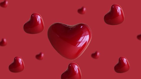  Flying and wiggle of different diameters red heart on trending red color gradient background. Romantic Love concept for mother's, St. Valentine's and women's day. Motion design graphics animation