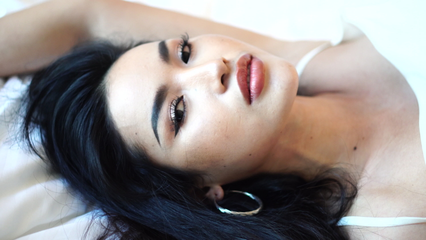 Portrait of Beautiful Asian Woman on Bed Posing to Camera, Sensual Female Model Close Up