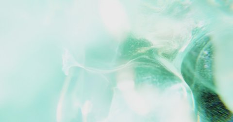 Smooth flowing abstract blue green turquoise ink smoke with wave and swirl motion background. 4K loop, 3D rendering