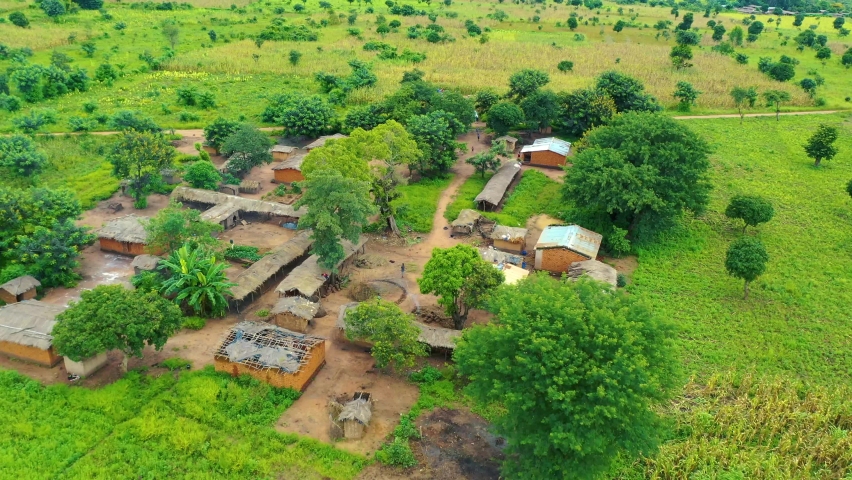 Drone flying low over a village in Malawi, Africa. Royalty-Free Stock Footage #1086432320