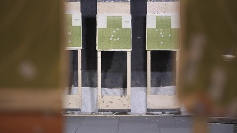 green Target for a shooting gallery with traces of a hit from a weapon