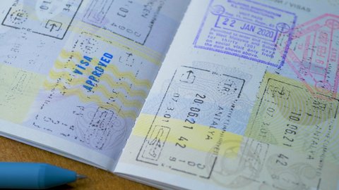 ANTALYA, TURKEY - CIRCA JANUARY, 2022: Visa stamp in passport ID. Entry in foreign country. Malaysia, Turkey, Antalya, Istanbul