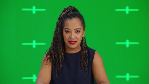 Newsroom TV Studio Live News Program with Green Screen Background: Female Presenter Reporting, Talking. Television Cable Channel Anchorwoman. Network Broadcast Mock-up Playback with Tracking Markers