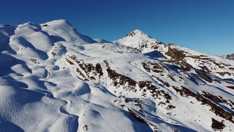 Aerial drone footage of the Jungfrau region ski resort near the Kleine Scheidegg train station in the Berner Oberland alps near Interlaken in Switzerland