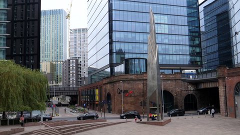 SALFORD, ENGLAND, UNITED KINGDOM - CIRCA SEPTEMBER, 2021: Contrasting old red brick and modern steel and glass architecture around Greengate Square in the new development and regeneration area.