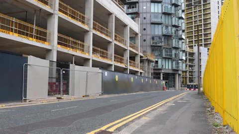 SALFORD, ENGLAND, UNITED KINGDOM - CIRCA SEPTEMBER, 2021: New development building site in Greater Manchester, tilt up shot.