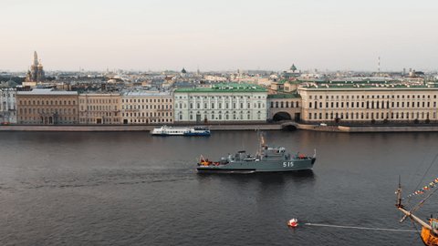 Aerial landscape of a modern military boat goes along the Palace embankment at early morning, a replica of the ancient frigate Poltava before the holiday of the Russian Navy,Winter palace
