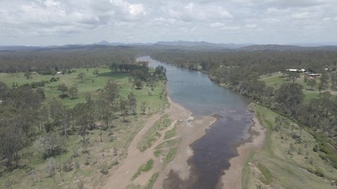Benaraby Public Campgrounds And Boyne River On A Sunny Summer Day - Rural Town In QLD, Australia. - aerial