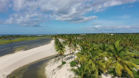 Panorama aerial view of Jericoacoara Ceara Brazil. Scenic summer dunes beach at famous travel destination. Blue sky and desert dunes.