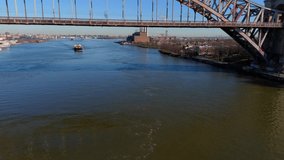 This video shows a view of the Hell Gate bridge in Bronx, NY.  The Hell Gate Bridge is a 1,017-foot steel through arch railroad bridge in New York City.