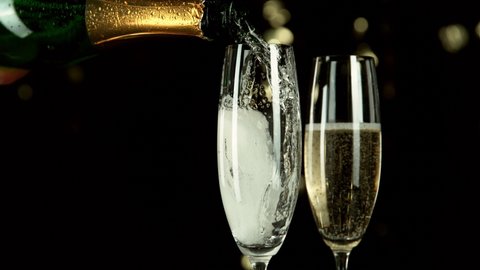 Super slow motion of pouring champagne wine with camera motion. Speed ramp effect. Filmed on high speed cinema camera, 1000fps.