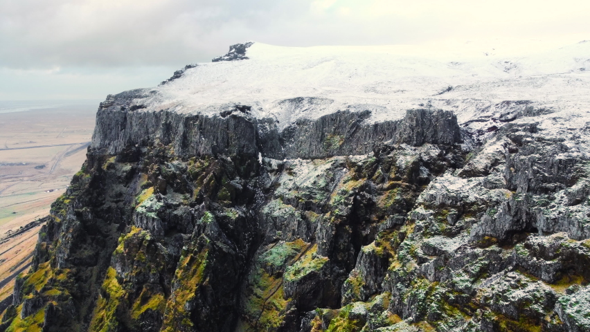 Icelandic volcanic mountain landscape with snow, Wild winter untouched inaccessible nature, Snow covers mountain peaks, Iceland