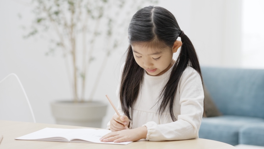 A child studying in the living room Royalty-Free Stock Footage #1086499151