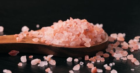 Himalayan pink salt in a wooden is used to flavor food. Due mainly to marketing costs, pink Himalayan salt is up to twenty times more expensive than table or sea salt.