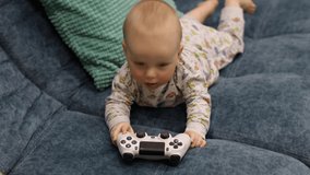 4K Footage A small child plays with a joystick from a game console