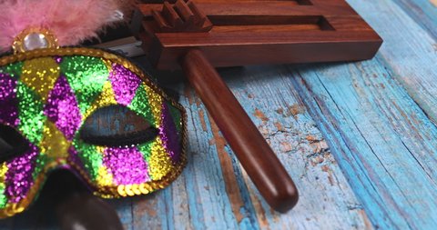 Jewish carnival Purim celebration on hamantaschen cookies, noisemaker and mask