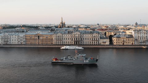 Aerial landscape of a modern military boat goes along the Palace embankment at early morning, a replica of the ancient frigate Poltava before the holiday of the Russian Navy,Winter palace