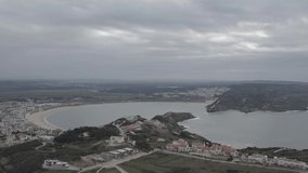 Aerial drone view of scenic coast on cloudy day