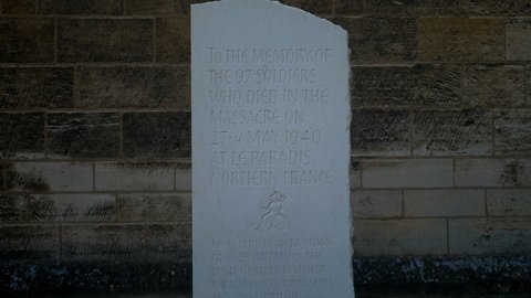 Norwich, Norfolk, United Kingdom. Circa June 2021. Stone memorial at Norwich Cathedral  to members of Royal Norfolk Regiment executed by Nazi SS soldiers in May 1940 at Le Paradis in France. 
