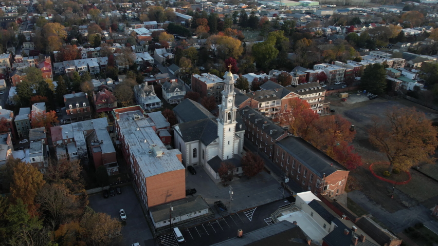 Aerial View of Frederick Maryland USA Downtown and St John the Evangelist Roman Catholic Church - Orbiting Drone Shot