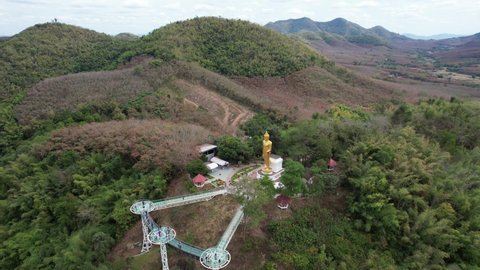 Aerial view by drone of the big buddha statue and skywalk by the Mekong river in Loei, Thailand