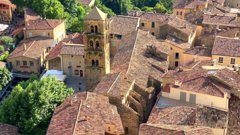 Moustiers-Sainte-Marie, France - August 2021 : Village of Moustier Sainte Marie in Provence, France with a view on the bell tower of the Notre-Dame-de-l'Assomption church