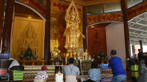 Buddha statue for thai people and foreign travelers travel visit and respect praying with holy mystery at Wat Charoen Rat Bamrung or Nong Pong Nok temple on January 27, 2022 in Nakhon Pathom, Thailand