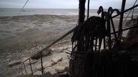 Taganrog. Fishing village. View of the low tide with anchor and ropes.