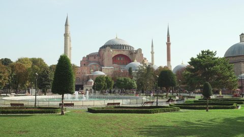 Awesome view of the Hagia Sophia among green gardens in Istanbul, Turkey. The Grand Mosque and formerly the Church is a popular destination among pilgrims and tourists of the world.