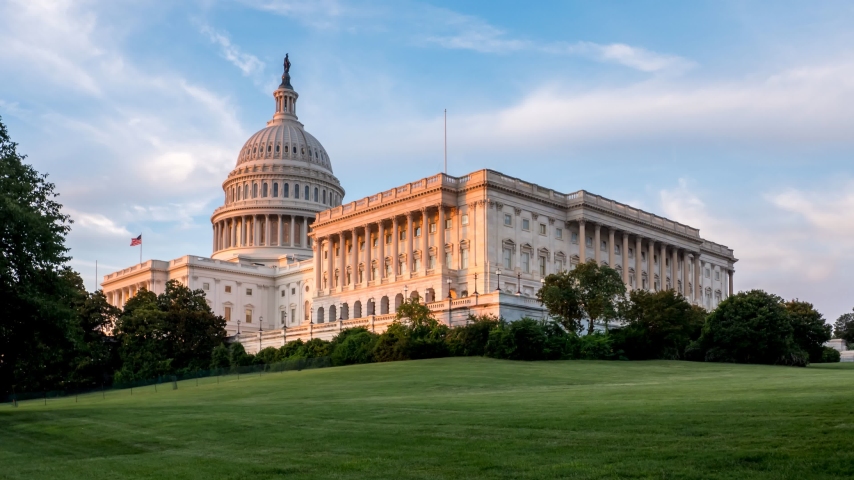Sunset Time Lapse of the US Congress from the side with Colorful Skies and Clouds