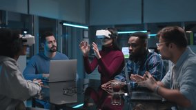 Young diverse start-up team discuss business strategy wearing vr headset late in office. Creative multiethnic colleagues having meeting  - Powered by Shutterstock - Get 15% off with code: PIKWIZARD15
