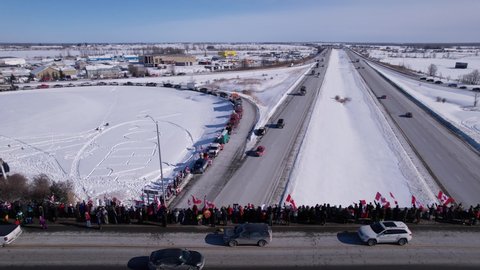 Freedom Rally 2022 drives past supporters protesting the vaccine mandates in Casselman, Ontario on their way to Ottawa.