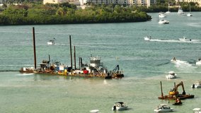 Aerial parallax drone video Dredging barge Miami Haulover sandbar