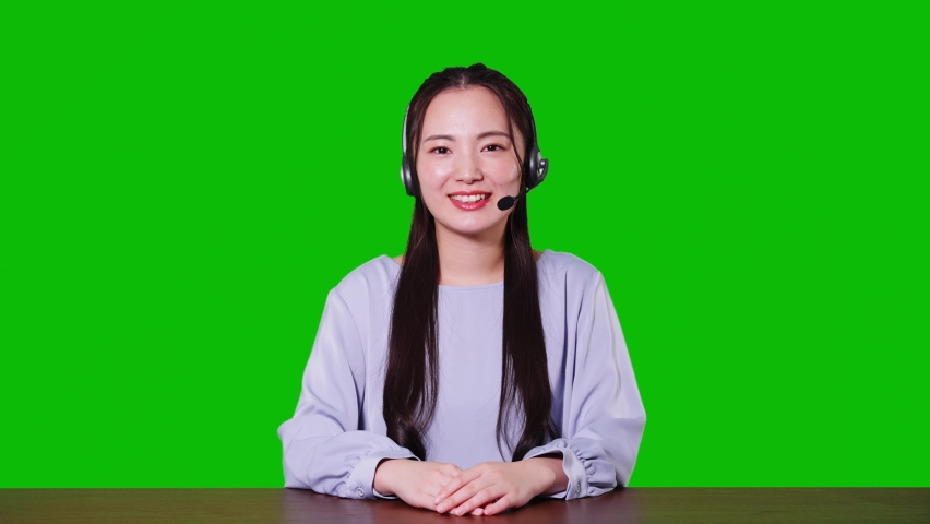 Young asian woman taking video calling. Green background for chroma key composition. | Shutterstock HD Video #1086568244