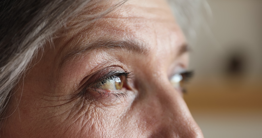 Senior Hispanic brown-eyed woman staring into distance looking serious and thoughtful, close up cropped face view. Ophthalmology, eyesight and vision check up clinic services for older citizen concept Royalty-Free Stock Footage #1086568814