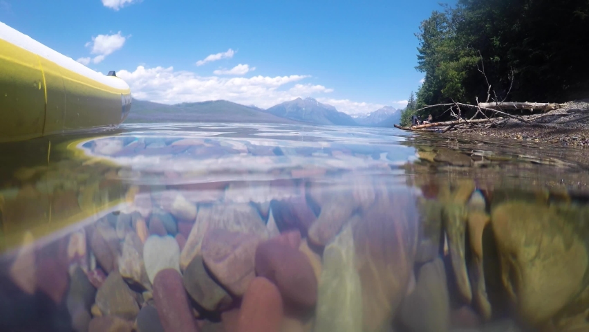 Underwater digging for rocks in Lake McDonald Glacier National Park Montana Royalty-Free Stock Footage #1086569384