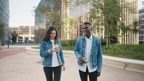 Multiracial friends with coffee walking in city - Powered by Shutterstock - Get 15% off with code: PIKWIZARD15