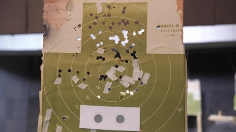 green Target for a shooting gallery with traces of a hit from a weapon (Мишень фигурная - translate - Curly target)