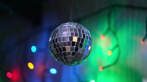 Disco ball on the background of colored lights