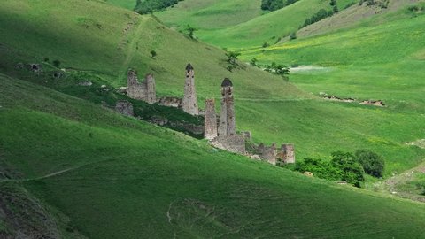 Medieval tower complex in the mountains and shadows of clouds, Ingushetia, Russia, 4k