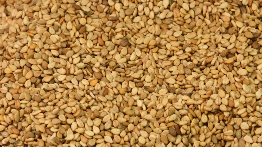 Sesam seeds on a turn table in a closeup 
 | Shutterstock HD Video #1086584531