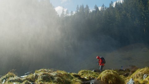 Hiking photographer takes picture of epic waterfall