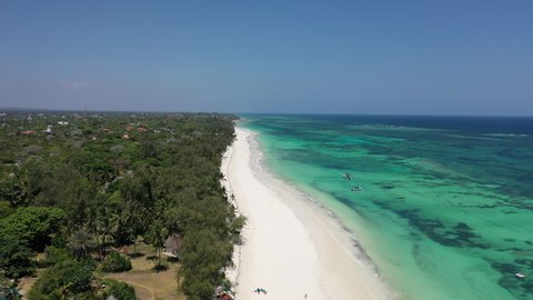 Diani beach Kenyan coast African Sea drone aerial 4k waves blue indan ocean tropical mombasa turquoise white sand East Africa palms paradise view