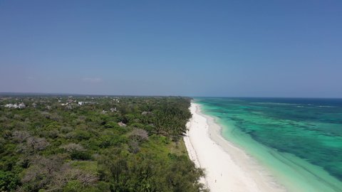 Diani beach Kenyan coast African Sea drone aerial 4k waves blue indan ocean tropical mombasa turquoise white sand East Africa palms paradise view